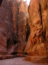 Rock Chasm * One of the many colorful formations in the Siq, the main entrance to Petra.  At the lower part of the rock is a channel, dug to carry rain water to the city. * 431 x 576 * (96KB)